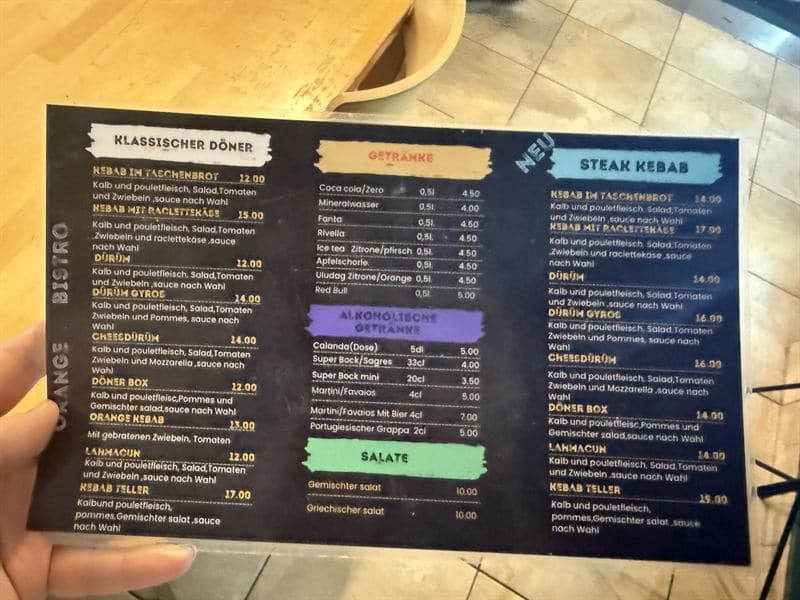 Speisekarte des Orange Bistro: Döner, Steak Kebab, Getränke und Salate